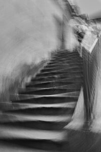 Blurry woman on blurry stairs in Porto