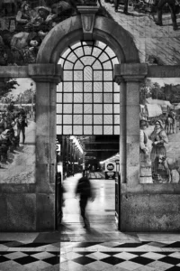 Blurry person walking to the tracks at Sao Bento railway station, Porto.